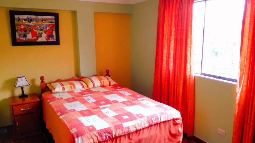 Postel nebo postele na pokoji v ubytování Residencial Norandes