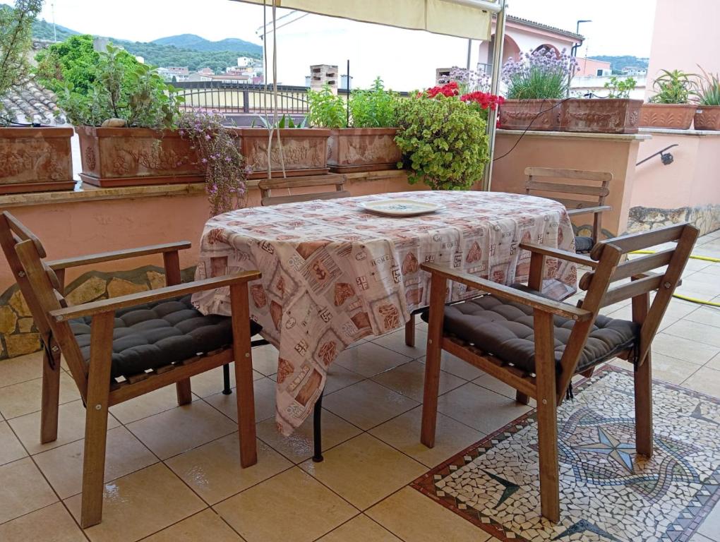 a table and two chairs sitting around a table on a balcony at Casa Mare Teulada Sardegna in Teulada
