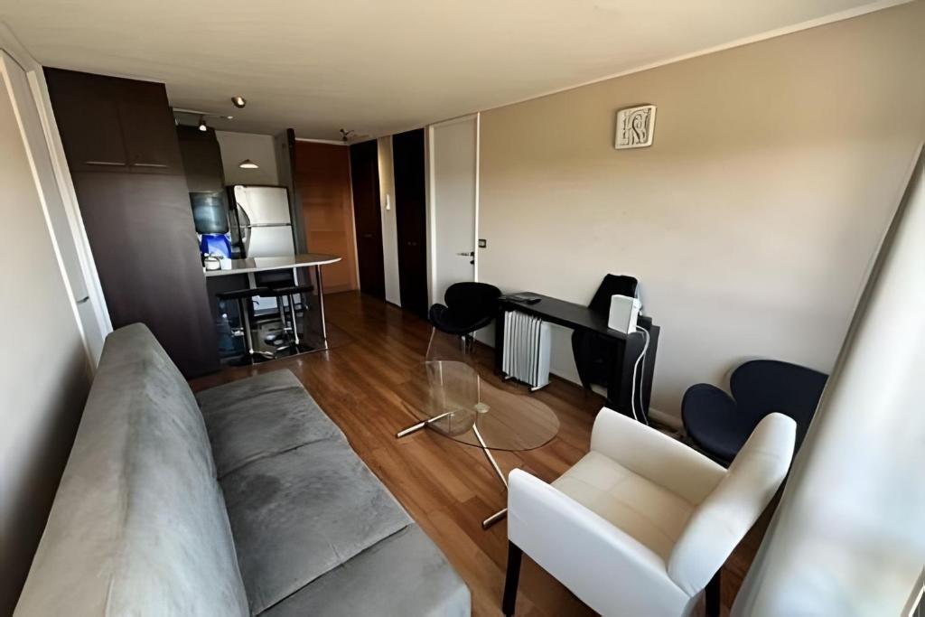 a living room with a couch and a table at Departamento en Calama in Calama