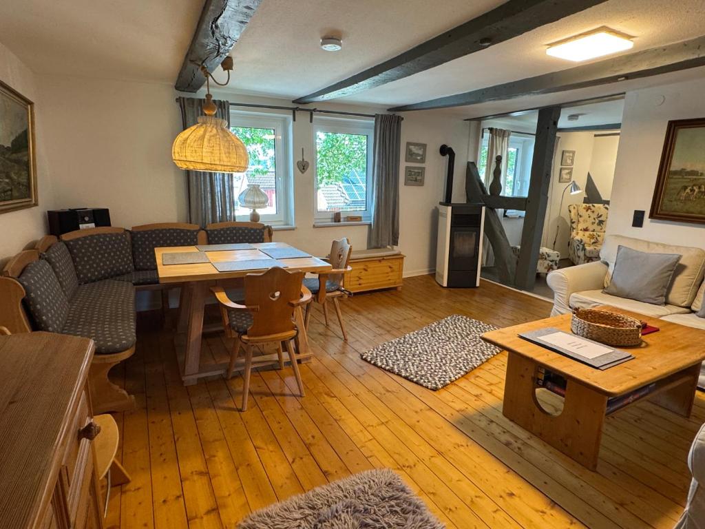 a living room with a couch and a table at Ferienwohnung Sonnentau 1 in Holzminden