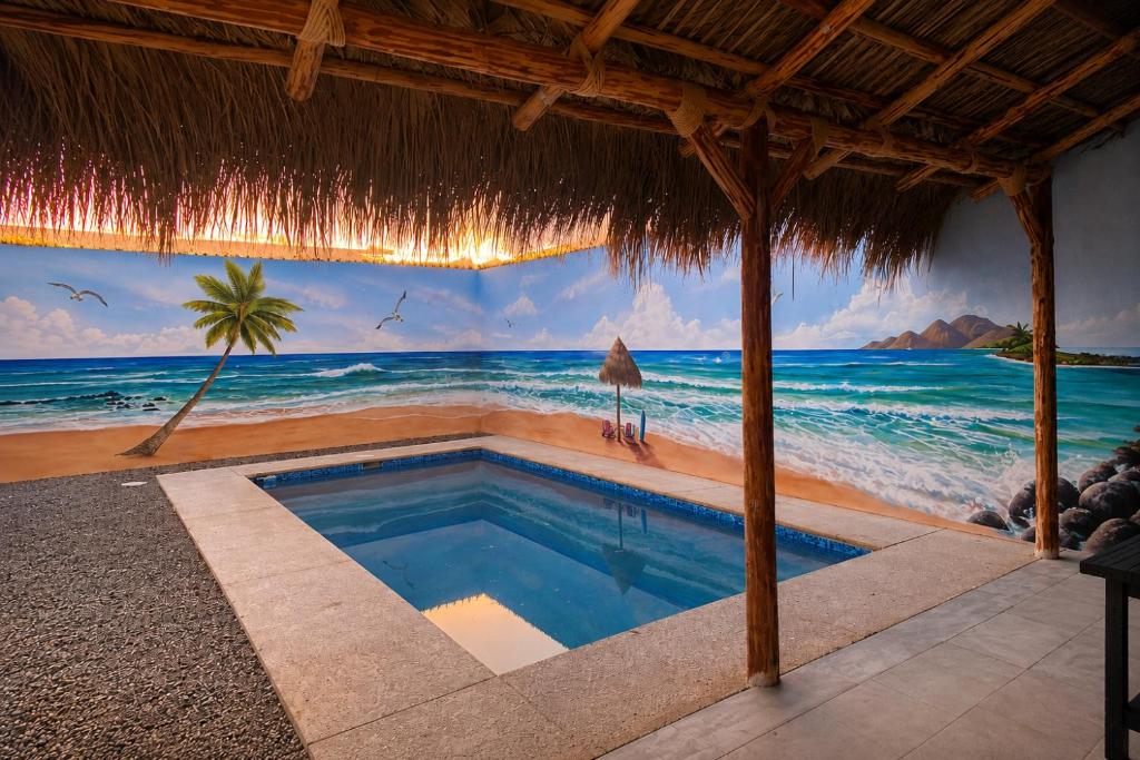 a swimming pool with a mural of the ocean at Rocky point beach house. in Puerto Peñasco