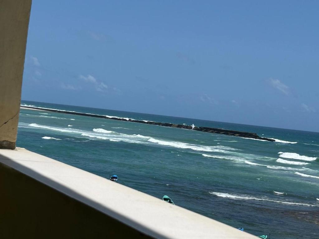 a view of the ocean from a balcony at Aluruba Residence in Mogadishu