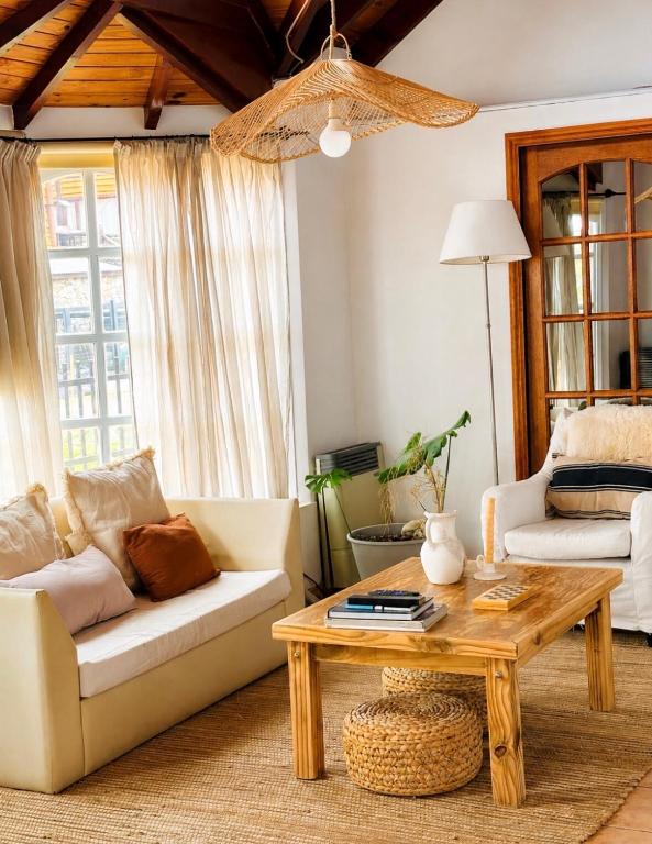 a living room with a couch and a coffee table at Las Margaritas in Ushuaia