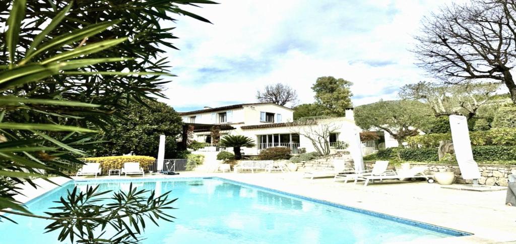 a swimming pool in front of a house at Maisonn La Turbie - Privateee pool in La Turbie