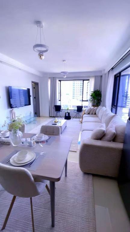 a large living room with couches and a table at SS Kileleshwa Homes in Nairobi