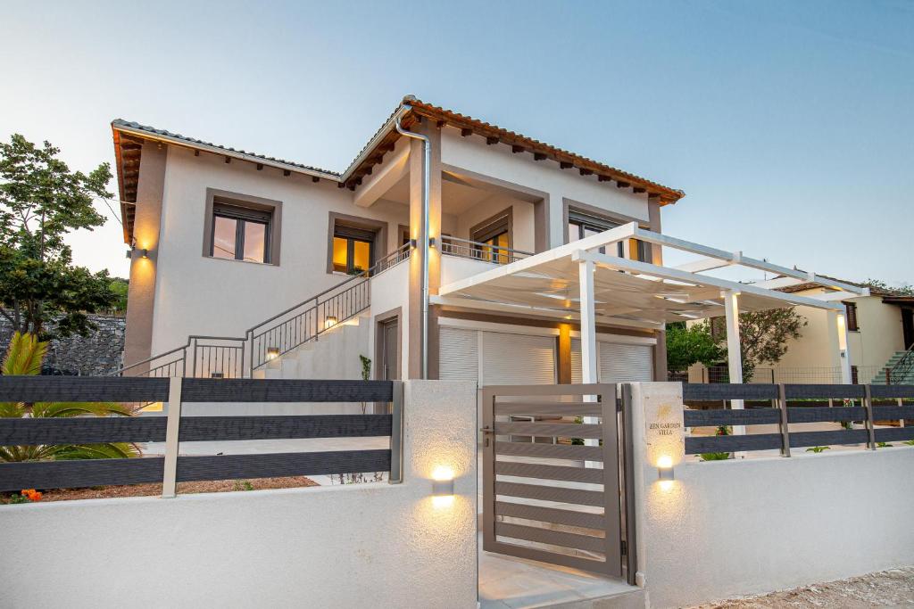 a house with a gate in front of it at Zen Garden Villa in Theológos