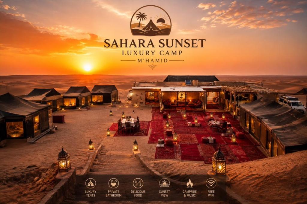 a view of a luxury camp in the desert at sunset at Sahara Sunset Luxury Camp M'hamid in Mhamid