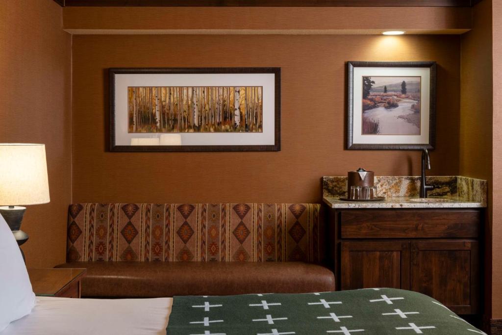 a hotel room with a bed and a desk at Wayfinder Bishop in Bishop