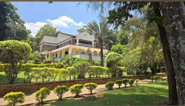 a large house in the middle of a garden at Ilemi Gardens in Nairobi