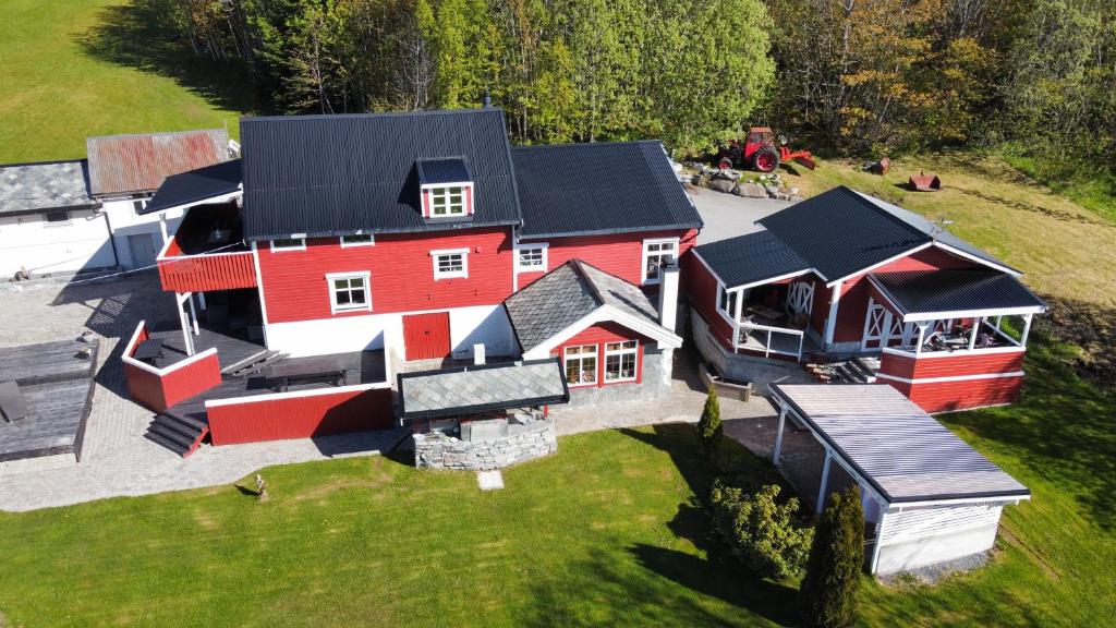 an aerial view of a large red house with black roofs at Eidsviklaaven in Ålesund