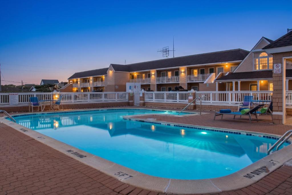 a large swimming pool in front of a hotel at Hatteras Island Inn in Buxton