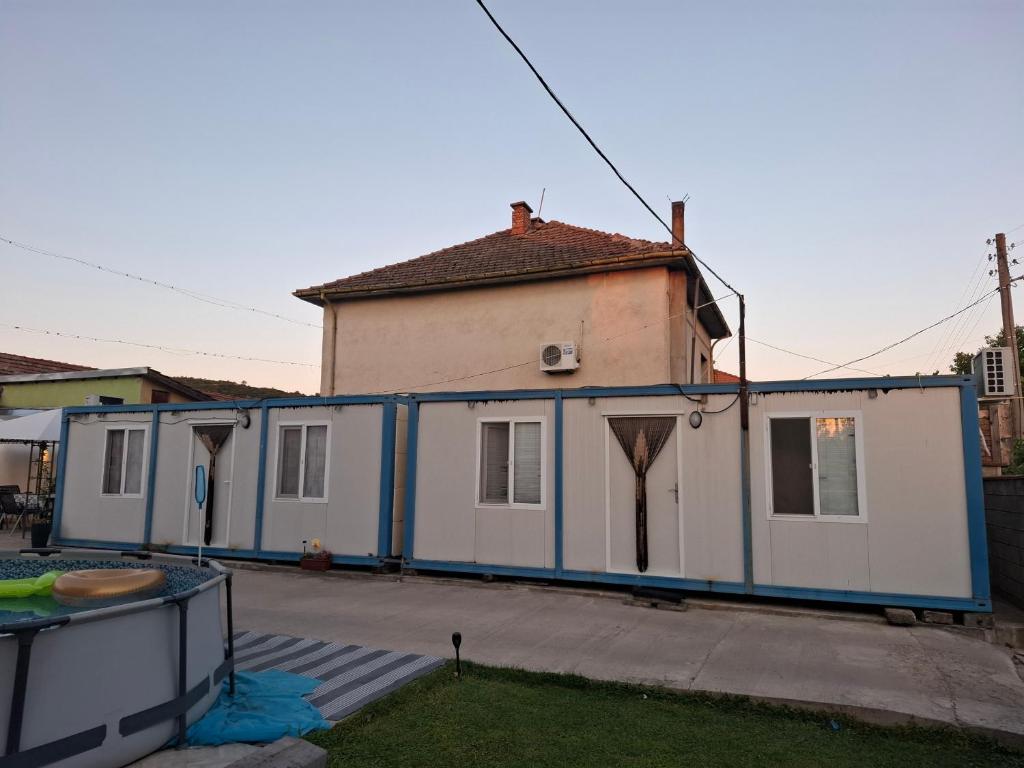 a house with blue and white paint on it at Blue and white in Pleven