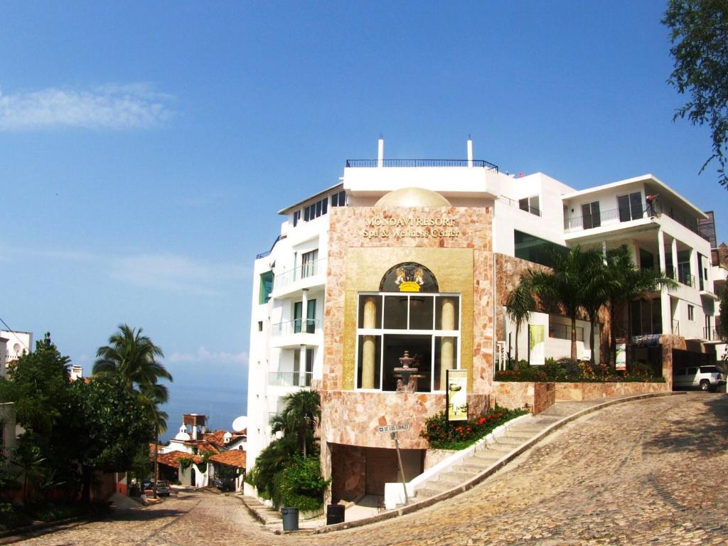 a large white building on the side of a road at Mondavi in Puerto Vallarta