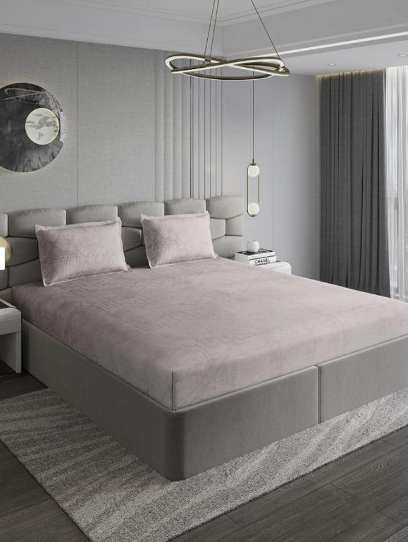 a bedroom with a large bed in a room at बिश्नोई भवन in New Delhi