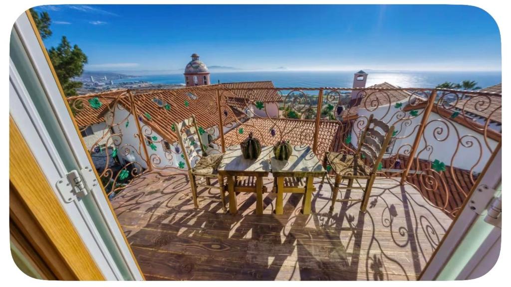 a view of a balcony with a table and chairs at Casa Nautilis in San Miguel