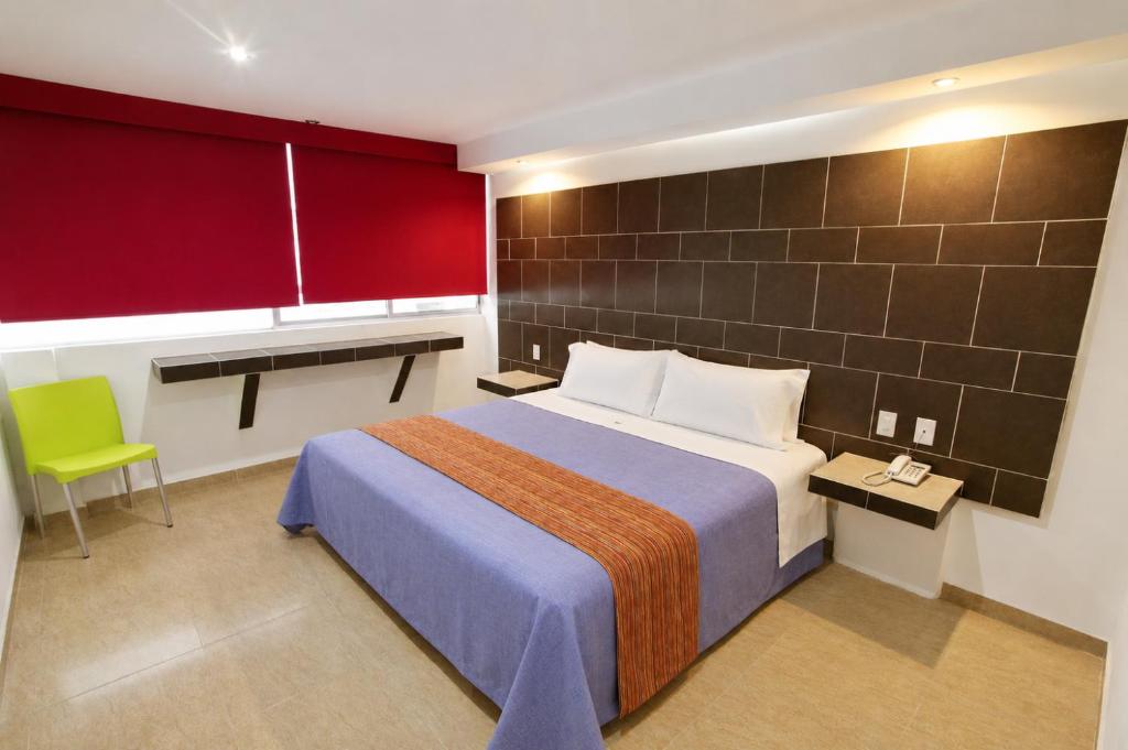 Postel nebo postele na pokoji v ubytování First Inn Hotel & Business