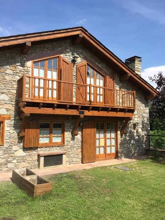 a house with a deck on top of it at Bellver-Baltarga in Bellver de Cerdanya