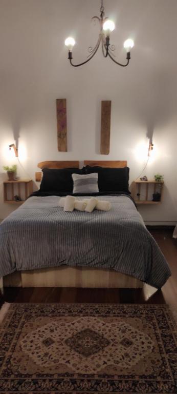 a bedroom with a bed with two towels on it at Pueblo Nómade in Tranqueras