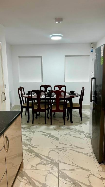 a dining room with a table and chairs at HomesRentals in Dudley