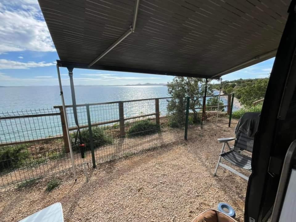 a view of the ocean from the inside of a rv at Relax Camp Pitches in Pakoštane