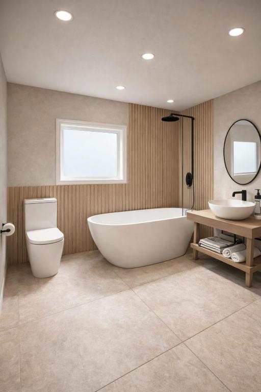 a bathroom with a tub and a toilet and a sink at A1 HighTown Aprtmnt, Steps frm Luton Train Station in Luton