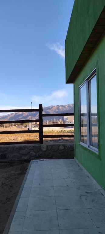 a green building with a view of the beach at Aromas de Cafayate in Cafayate