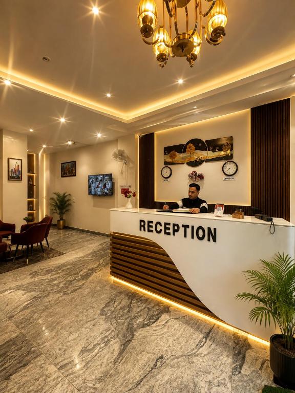 a reception desk in a hotel lobby with a boat at Hotel Ivory Delhi Airport in New Delhi