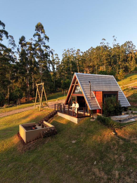 an overhead view of a small house with a playground at Caramelo Chalé in Rio do Sul