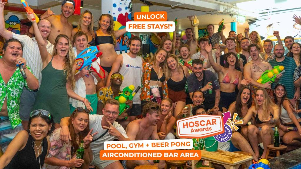 a group of people posing for a picture at a party at Mad Monkey Chiang Mai in Chiang Mai
