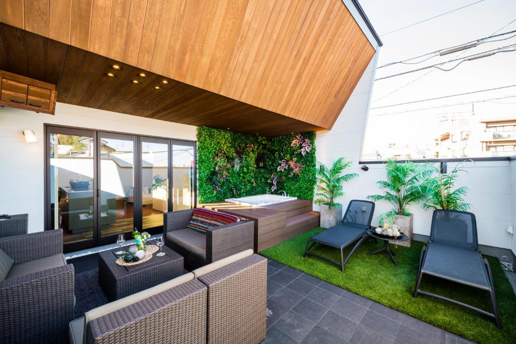 a patio with furniture and plants on a building at ResoLife in Kochi