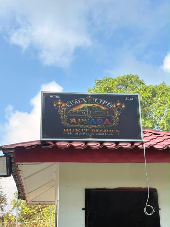 a sign on the top of a building at Hotel & Recreation Apsara Bukit Residen in Kuala Lipis