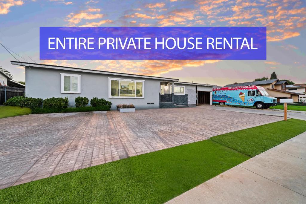 a house with a truck parked in a driveway at Entire Private House with King Bed, 80 TV, Gated Yard, Ranch Style, 4 Bedrooms 2 Bathrooms, Available Now in El Cajon