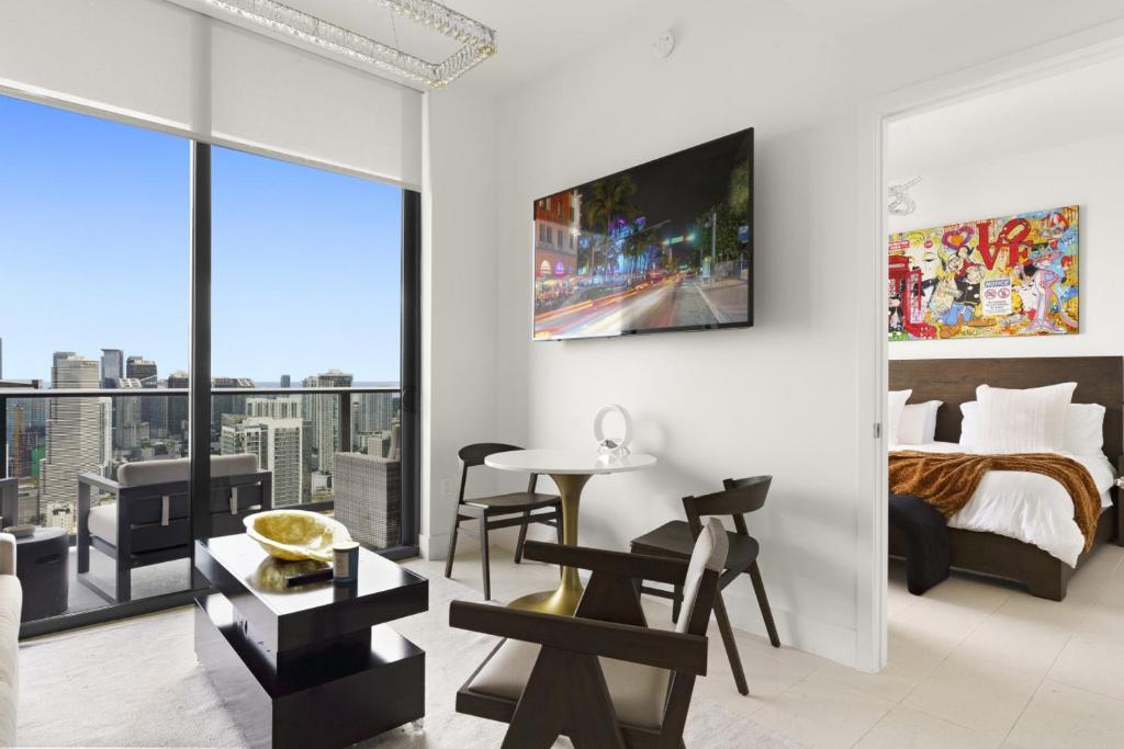 a bedroom with a bed and a view of a city at Luxury Penthouse Best Price ,Breathtaking Balcony Views, Ocean & City, Resort Pool, Spa, Gym, in Miami