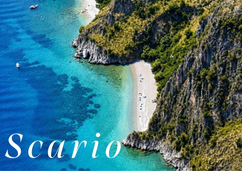 an aerial view of a beach and the ocean at Il Villaggio Hotel Residence Lì Cylentos Elios a 100 mt dal mare cilentomarexperience in Policastro Bussentino