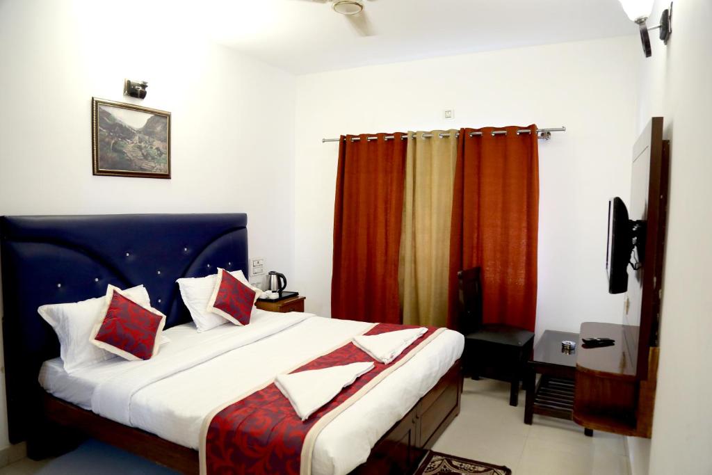 Säng eller sängar i ett rum på Hotel Cloud Coorg