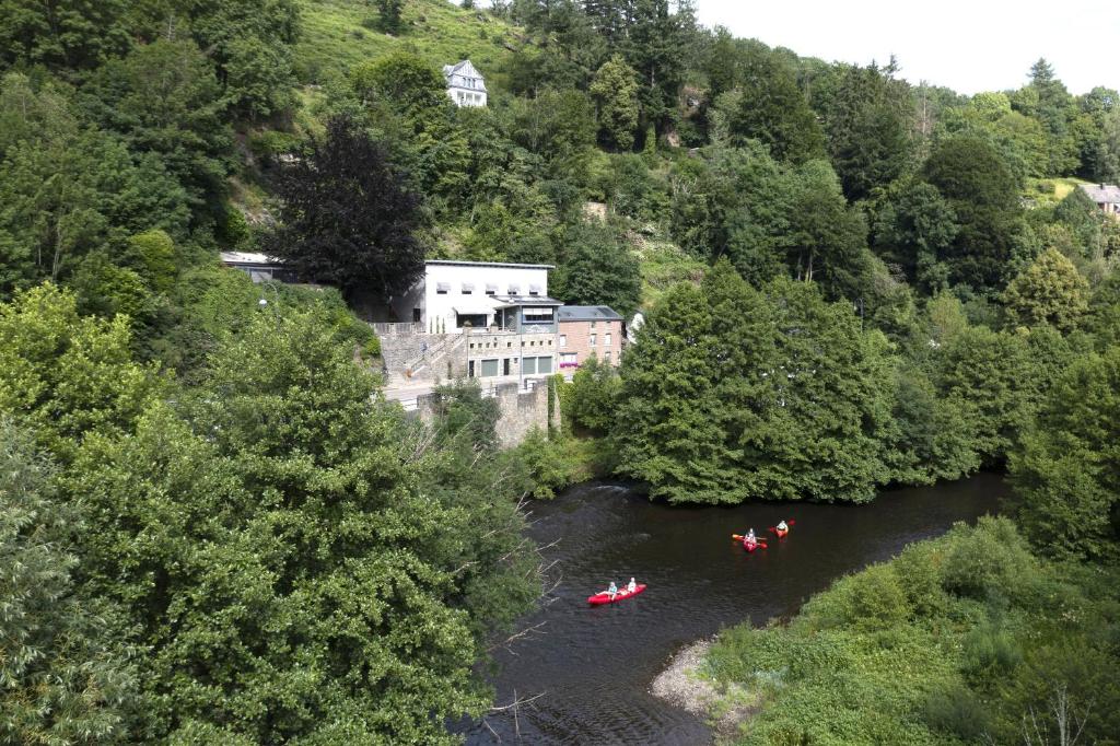 a group of people in kayaks on a river at LaVue - Forest Twin Rooms in La-Roche-en-Ardenne