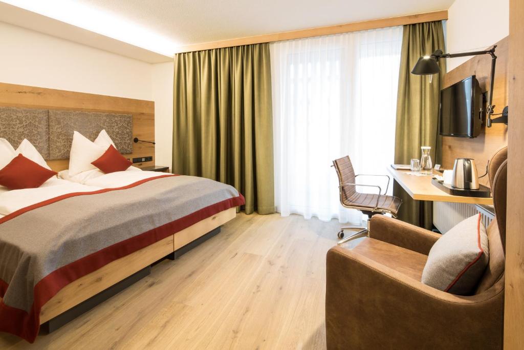 Letto o letti in una camera di Sonne 1806 - Hotel am Campus Dornbirn
