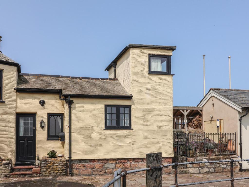 a bedroom house in the village of person at Sammy Hakes Cottage in Watchet