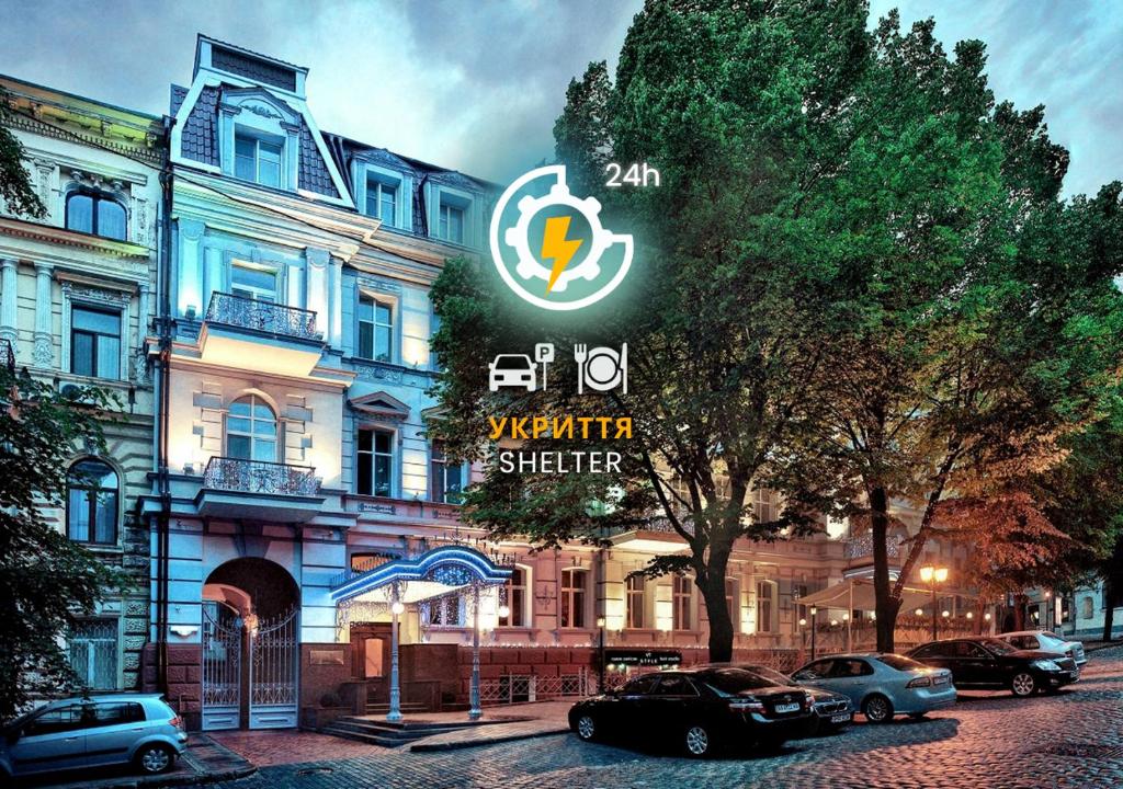 a building with cars parked in front of it at Continental Hotel in Odesa