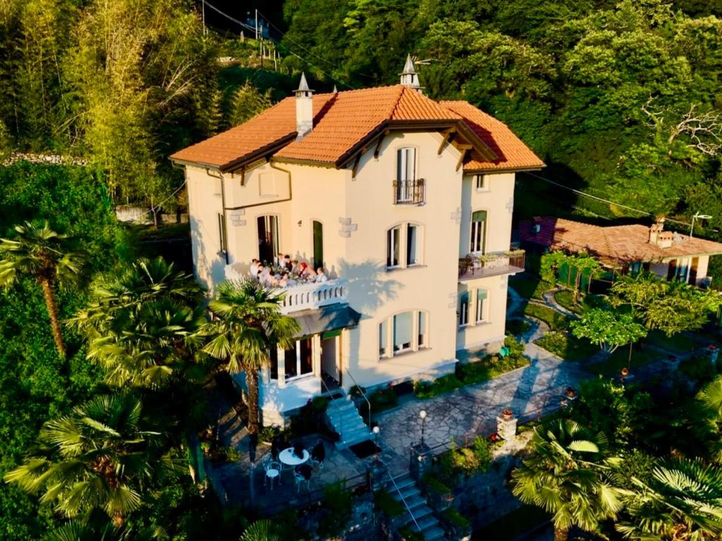 an aerial view of a house with palm trees at Villa Silvana in Perledo