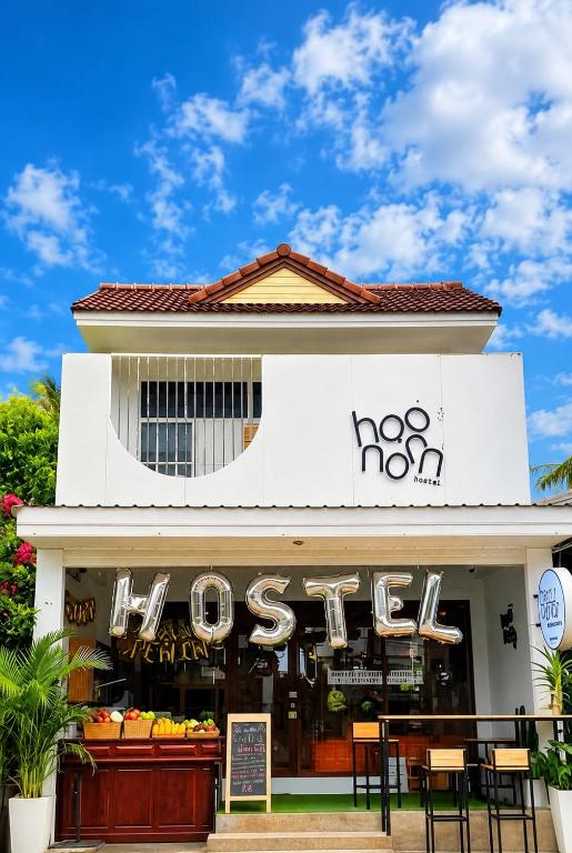 a store with a sign on the front of it at Haonorn Hostel in Thong Sala