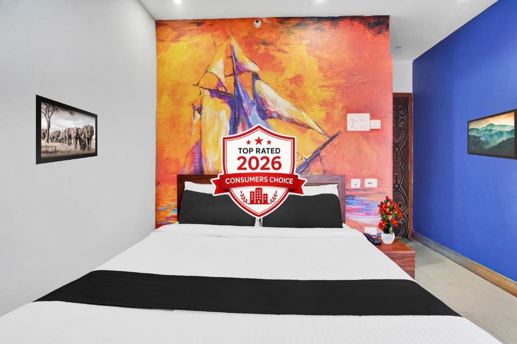 a bedroom with a bed with a sign on it at Super Townhouse Zoo Road Near Guwahati Central Formerly IR Luxuria in Guwahati