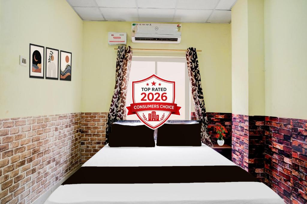 a room with a sign that reads at Collection O Ganeshguri Nayanpur Formerly Rainbow Residency in Guwahati