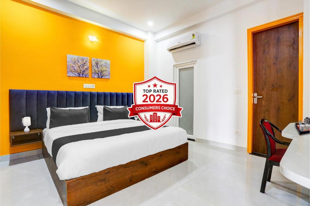 a bedroom with a bed with a sign that reads at Super Townhouse Sector 69 Gurgaon in Gurgaon