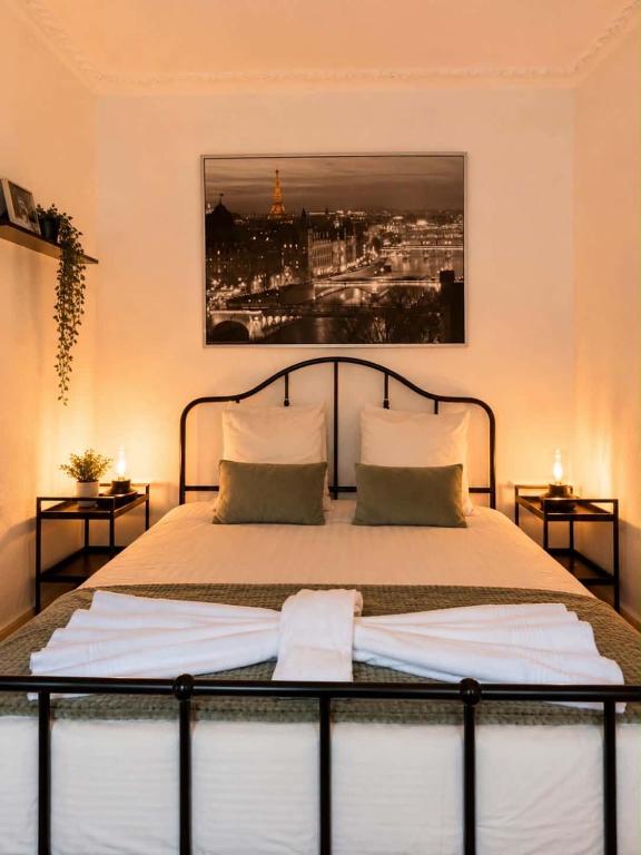 a bedroom with a bed with two pillows on it at Appart 3 pièce hyper centre Strasbourg in Strasbourg