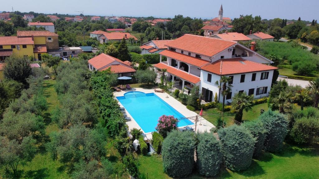 an aerial view of a house with a swimming pool at Apartments Ava in Babići