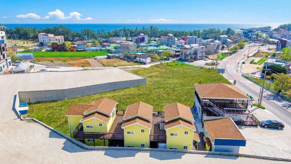 an aerial view of a city with houses at Samcheok Good Friend Pension in Samcheok