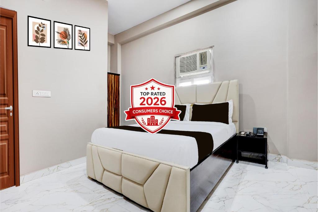 a bedroom with a bed with a sign on it at Collection O Sector 33 Gurgaon in Gurgaon