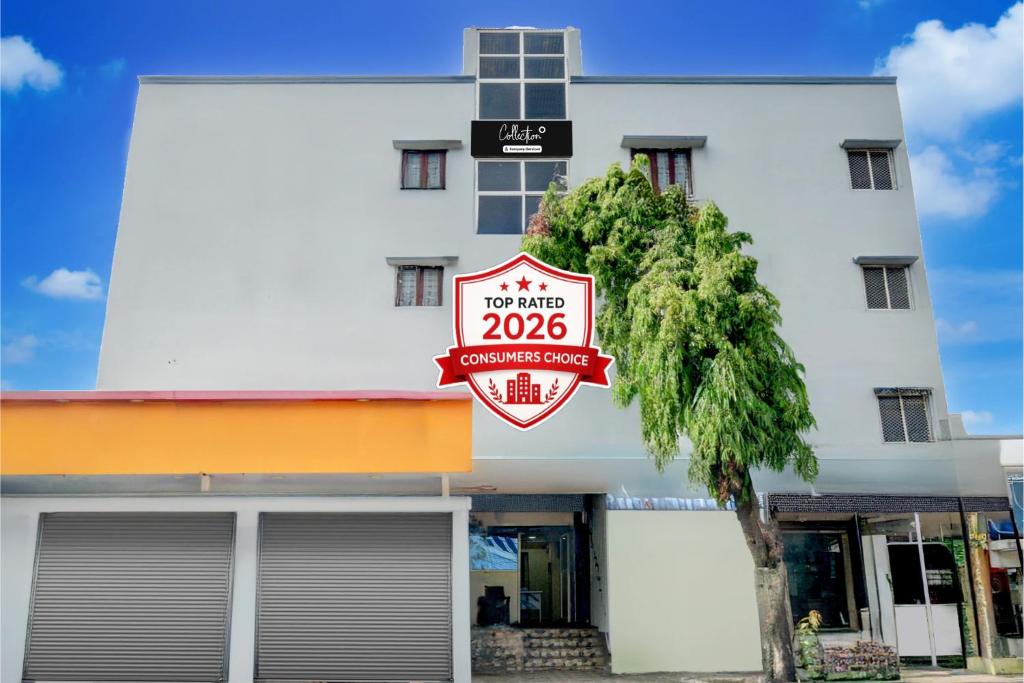 a white building with a sign that reads not only at Super Collection O Kothapet Near Omini Hospital in Upal