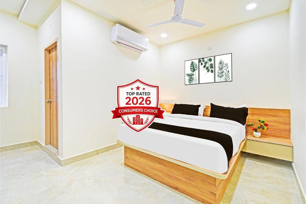 a bedroom with a bed with a sign that reads november at Super Townhouse Oak Kompally in Hyderabad